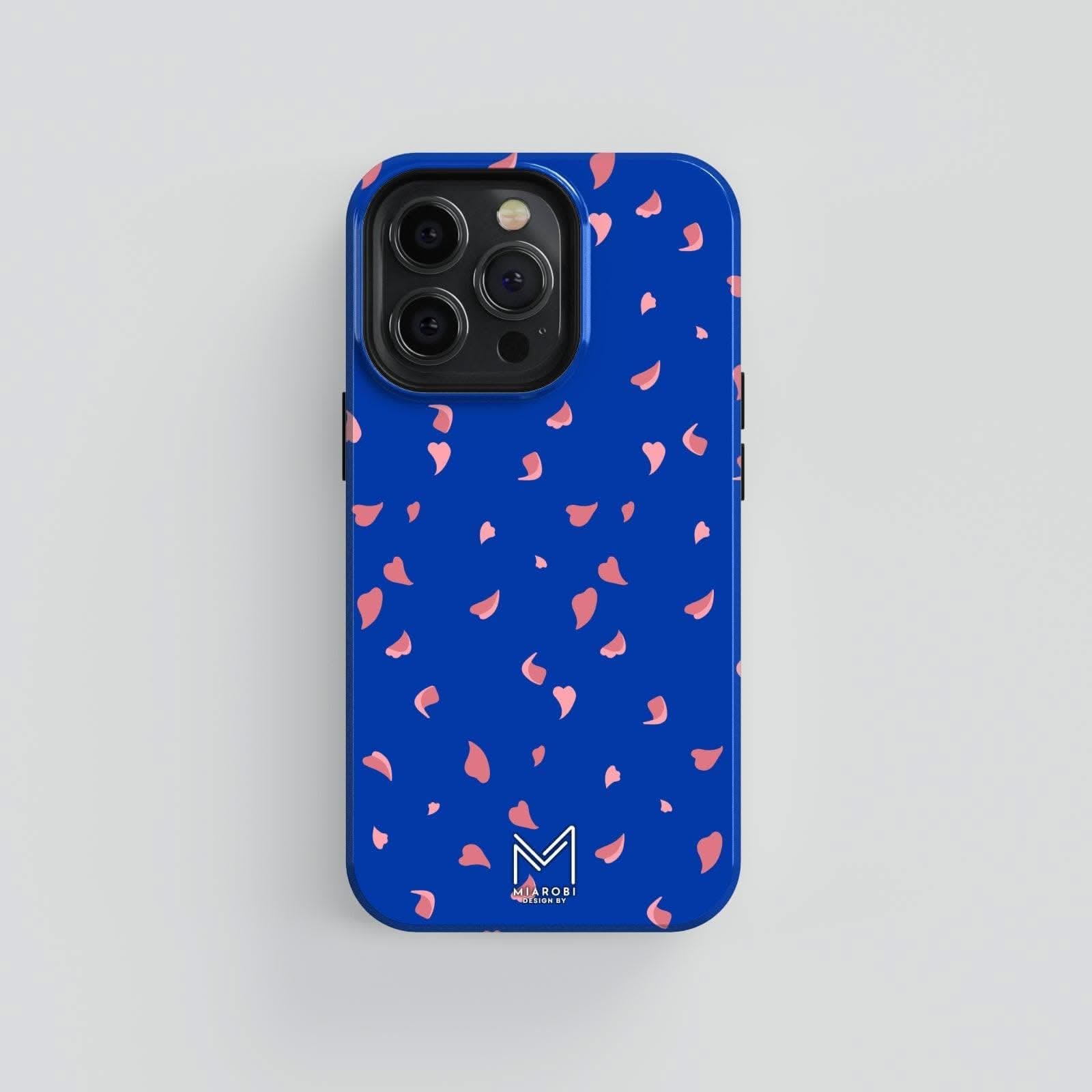 A blue phone case with scattered pink cherry blossom petals, showcasing a floral and aesthetic design.